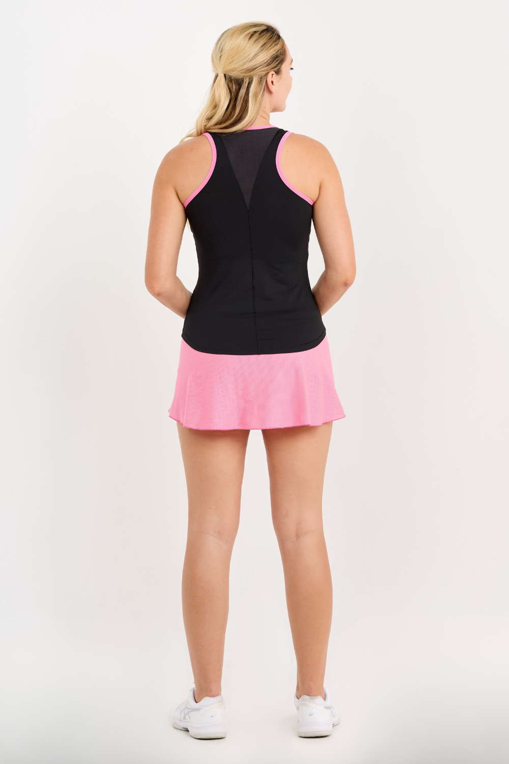 Sofibella Women's Black Racerback Tennis Tank Top with Pink Trim,back view on model