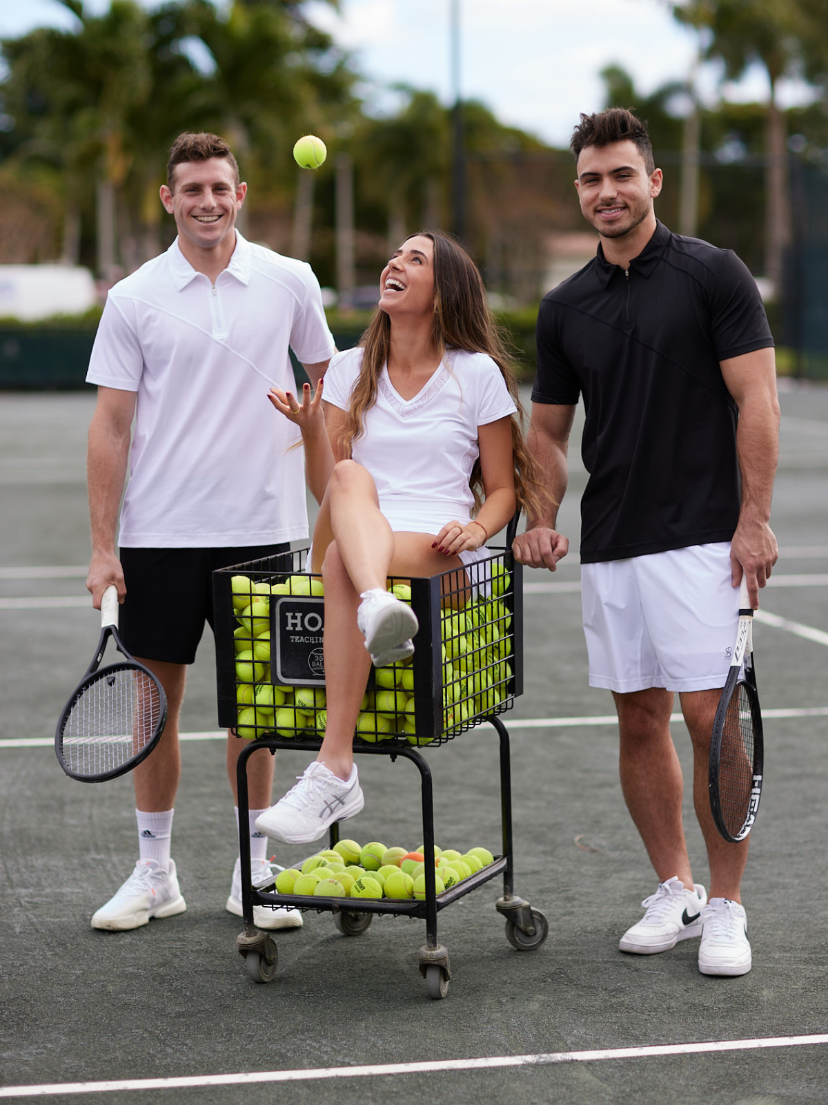 Men and Women's Tennis Apparel by Sofibella - two men and a woman on tennis court