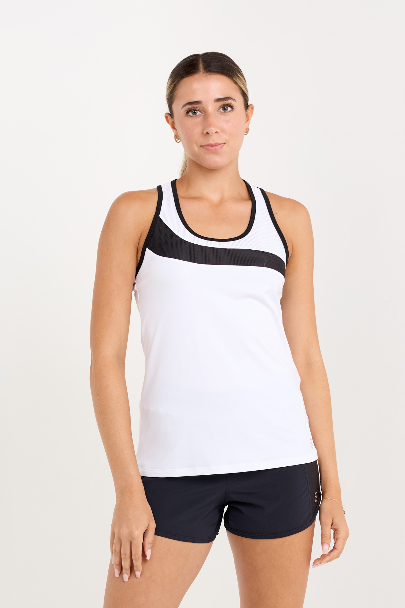 Monochrome women's tennis racerback top with mesh inserts, close up view