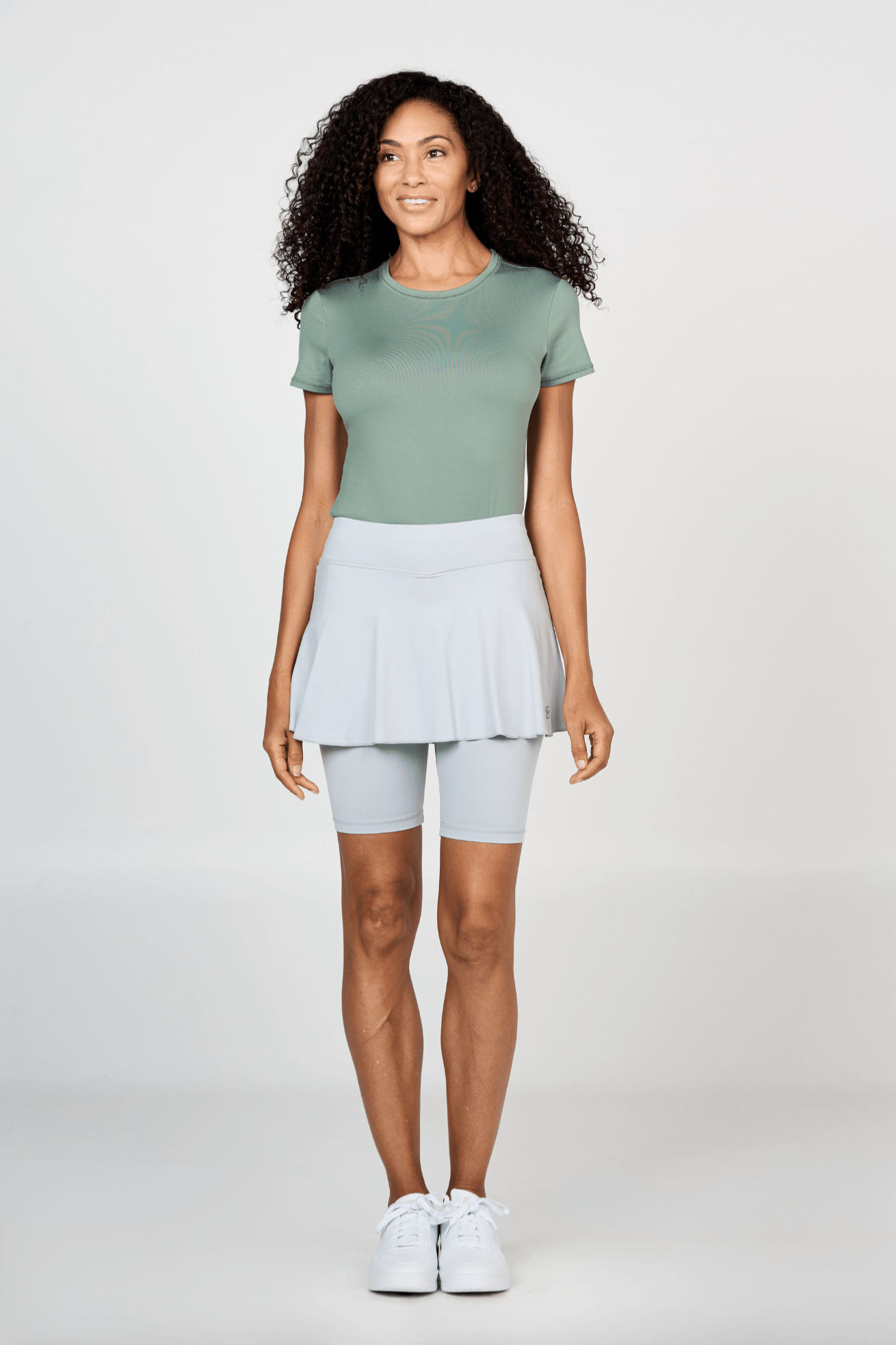 Women's Jan Bermuda Grey Tennis Skort with Built-In Biker Shorts and Ball Pocket by Sofibella, front view